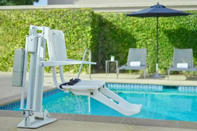 a white chair sitting next to a swimming pool at Courtyard Culver City Los Angeles in Los Angeles