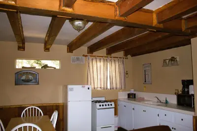 a kitchen with a white refrigerator and a stove at Goldmine Lodge in Big Bear Lake