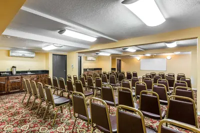 a room with rows of chairs and a whiteboard at Quality Inn & Suites Bell Gardens-Los Angeles in Bell Gardens