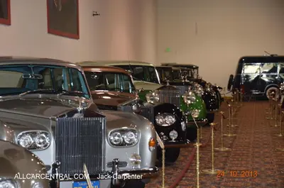 a row of old cars parked in a room at Value Inn in Sylmar