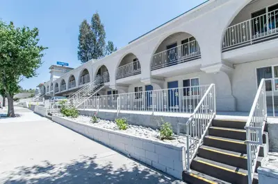 a building with stairs and balconies on it at Motel 6-Orange, CA - Anaheim in Anaheim