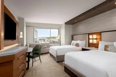 a hotel room with two beds and a desk at JW Marriott, Anaheim Resort in Anaheim