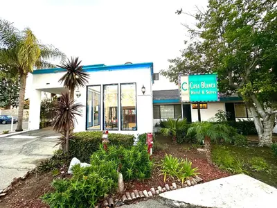 a fast food restaurant with a sign in front of it at Casa Blanca Hotel - Orange in Orange