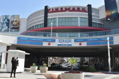 a man standing in front of a building at People's Choice Central Location Prkg & Patio LBD in Long Beach