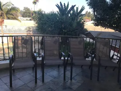 a group of chairs sitting on a balcony at Luxurious 3 BD in Culver City with POOL &HOT SPA in Los Angeles
