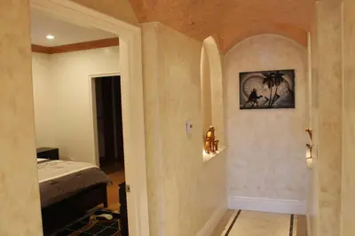 a bedroom with a bed and a wall with a picture at Luxurious 3 BD in Culver City with POOL &HOT SPA in Los Angeles