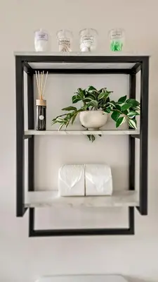 a shelf with a potted plant on a wall at Studio Mins to LAX , Venice Beach & Sony Studios CC B in Los Angeles