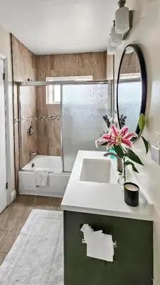 a bathroom with a sink and a bath tub at Studio Mins to LAX , Venice Beach & Sony Studios CC B in Los Angeles