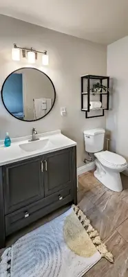 a bathroom with a sink and a toilet and a mirror at Studio Mins to LAX , Venice Beach & Sony Studios CC B in Los Angeles