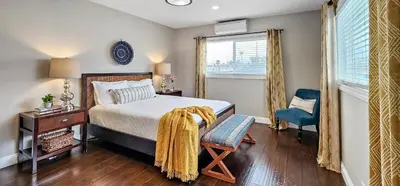 a bedroom with a bed and a chair and a window at Top Pick Walk to Restaurants, Shops & Near Beach CC C in Los Angeles