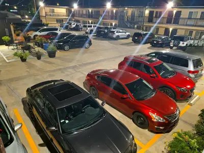 a group of cars parked in a parking lot at Portofino Inn Burbank in Burbank
