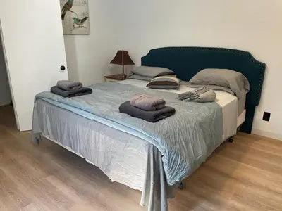 a bedroom with a bed with towels on it at Renovateed Two-Bedroom Apartment in Santa Monica in Los Angeles