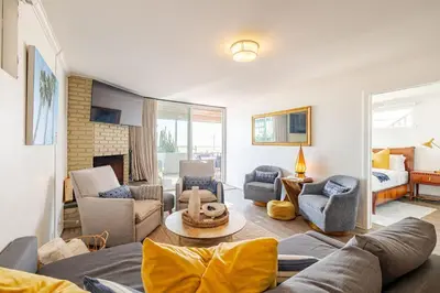a living room with a couch and chairs at Oceanfront Oasis in Long Beach