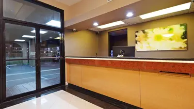 a kitchen with a counter with a sink at Best Western Pasadena Inn in Pasadena