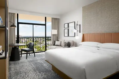 a hotel room with a large bed and a desk at Sheraton Park Hotel at the Anaheim Resort in Anaheim