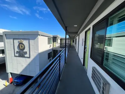 a hallway of a building with a balcony at Deluxe Inn Hawthorne/ LAX in Hawthorne