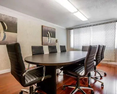 a conference room with a table and chairs at Quality Inn & Suites Montebello - Los Angeles in Montebello