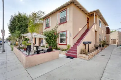 a house on a street with a table and chairs at New Belmont Shore Retreat with free Parking Walk to Beaches in Long Beach