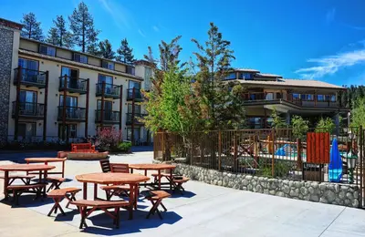 a group of tables and chairs in front of a building at Holiday Inn Resort The Lodge at Big Bear Lake by IHG in Big Bear Lake