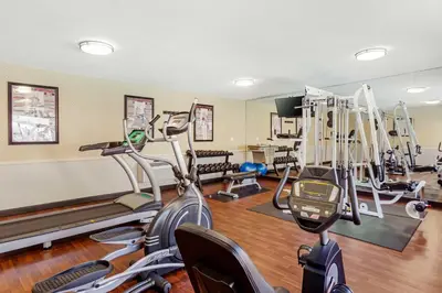 a gym with several treadmills and exercise bikes at Best Western China Lake Inn in Ridgecrest