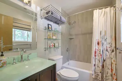 a bathroom with a sink and a toilet and a tub at Lake Arrowhead Family Home with Game Room in Lake Arrowhead