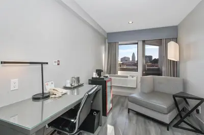 a hotel room with a desk and a chair at Aiden Los Angeles Downtown Dragon Gate Inn in Los Angeles