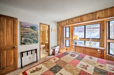 a bedroom with a bed with a quilt on it at Spacious Lake Arrowhead Home with 2 Decks and Views in Lake Arrowhead