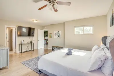 a bedroom with a bed and a living room at Fullerton Vacation Rental with Private Pool! in Fullerton