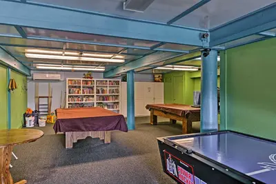 a room with a ping pong table and a pool table at Star House Unique Home with 360 Mountain Views! in Pine Mountain Club