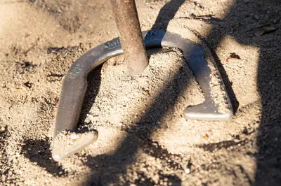 a pair of shovels sitting in the sand at Juniper Lakeside Couples Resort Cabin by Big Bear Vacations in Big Bear Lake