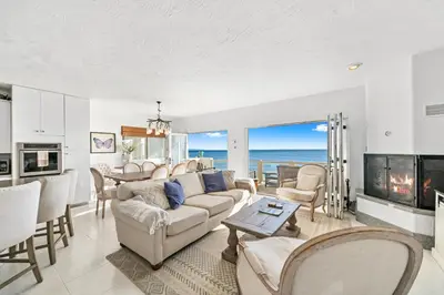 a living room with a couch and a table at Beachfront Malibu House with Sauna and Ocean-View Deck in Malibu