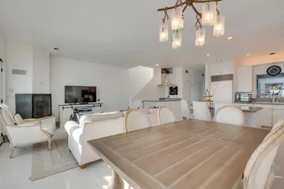 a dining room and living room with a table and chairs at Beachfront Malibu House with Sauna and Ocean-View Deck in Malibu
