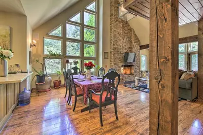 a dining room with a table and chairs at Incredible Lake Arrowhead Home with Views and Decks! in Lake Arrowhead