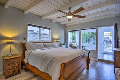 a bedroom with a bed and a ceiling fan at Remodeled Ventura Beach Home with Yard and Fire Pit! in Ventura