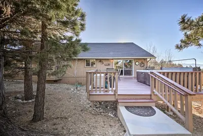 a house with a wooden deck with a tree at Hot Tub, Game Room and 2 Decks Luxe Big Bear Home in Big Bear Lake