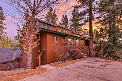 a house with a staircase in front of it at Hike, Ski, Fish Big Bear Lake Lodge with Deck in Big Bear Lake
