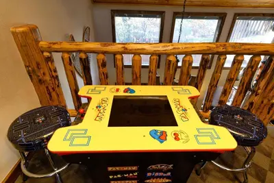 a table with a computer on top of it at Luxury Lodge-1888 by Big Bear Vacations in Big Bear Lake