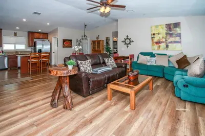 a living room with a couch and a table at Kitkats Hideaway-1874 by Big Bear Vacations in Big Bear Lake