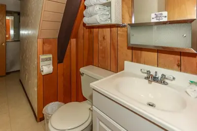a bathroom with a toilet and a sink at Makin' Memories At Summit-1683 by Big Bear Vacations in Big Bear Lake