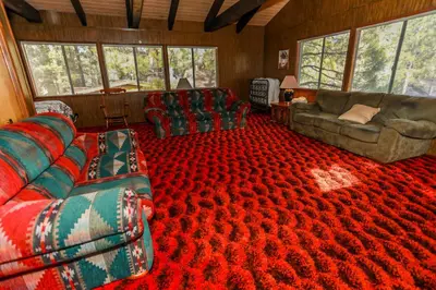 a living room with couches and a red carpet at Makin' Memories At Summit-1683 by Big Bear Vacations in Big Bear Lake