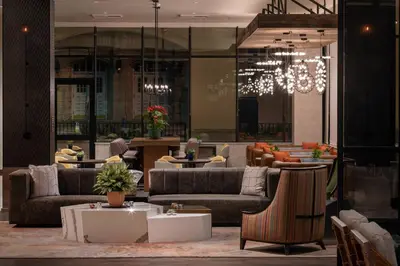 a lobby with couches and tables and a chandelier at Residence Inn Los Angeles Glendale in Glendale