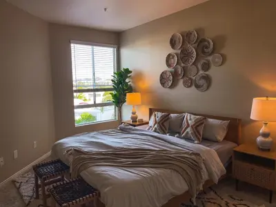 a bedroom with a bed with a window and plates on the wall at Sunny 1BDR centrally located in Marina del Rey in Los Angeles
