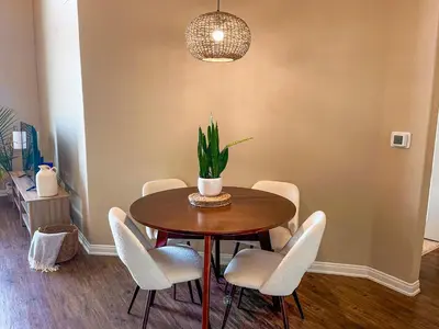 a dining room table with chairs and a potted plant at Sunny 1BDR centrally located in Marina del Rey in Los Angeles