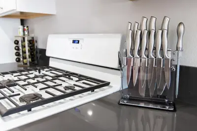 a kitchen counter with utensils next to a stove at Long Beach Duplex King Bed Pet Friendly Nurses Surgeon Business Travelers Near St Marys Medical Center & Downtown in Long Beach