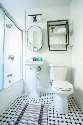 a bathroom with a toilet and a sink and a mirror at Newly Renovated Gem Mins to Convention Center, Beaches and Downtown LB A in Long Beach