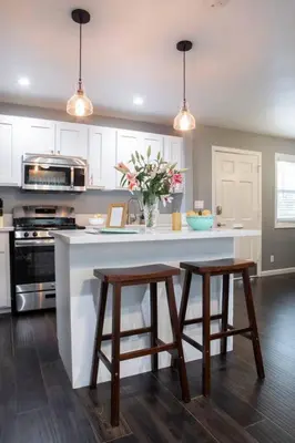 a kitchen with a kitchen island with two stools at Traveler's Pick Cozy, Near Beach & Dtwn,Prkg LB C in Long Beach