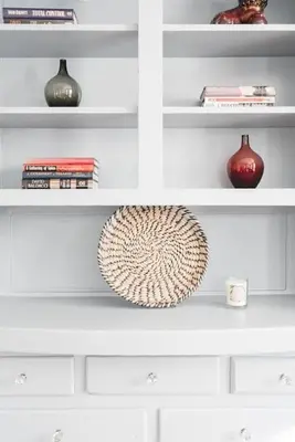 a white shelf with a bowl and vases on it at Historic Hm Mins to Beach, Convention Ctr Parking LB E in Long Beach