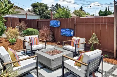a patio with four chairs and a fire pit at Stylish Hm Near Beach, Restaurants & Parking CC A in Los Angeles