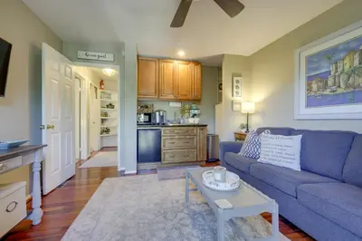 a living room with a blue couch and a table at Chic Peaceful Retreat 16 Mi to Beaches and Wineries! in Santa Paula