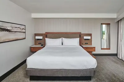 a bedroom with a large bed and two night stands at Doubletree By Hilton Fullerton in Fullerton